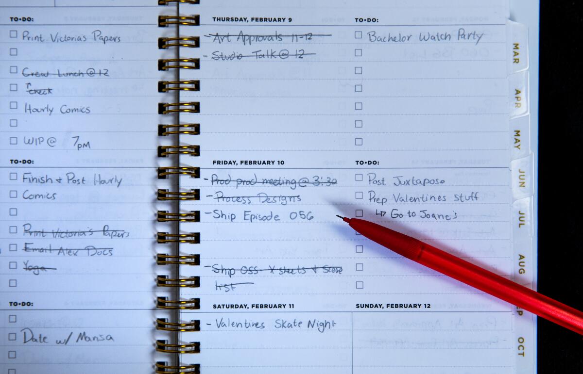 An open notebook with a bunch of to-do-list entries. Some are crossed out