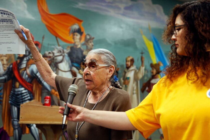 SAN BERNARDINO, CA-APRIL 17, 2019: Margaret B Cisneros, left, speaks at a town hall meeting at Our Lady of Hope Church on April 17, 2019, in San Bernardino, California. Hundreds of residents who want stable jobs and clean air, voiced their concern about a massive air cargo logistics center to be built in the area. (Photo By Dania Maxwell / Los Angeles Times)