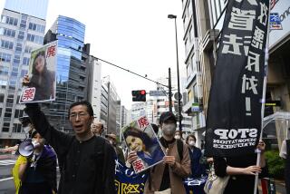 TOKYO, JAPAN - APRIL 16 : Citizens protest against the Amendment of Immigration Control Act in Japan on April 16, 2023 in Tokyo, Japan, as the Government of Japan plans to review the immigration control, the refugee recognition law, and the country's rules to detain and deport foreign nationals. Protesters holding placards and shouting slogans for the right of refugees, have denounced the violation of the International Law regarding the immigration detention in Japan, and asked justice for Sri Lankan woman Rathnayake Liyanage Wishma Sandamali, who had been detained at the Regional Immigration Services Bureauâs detention facility in Nagoya for overstaying her visa in 2020, and who died due to a lack of necessary medical care after complaining of ill health in the same detention facility on March 6, 2021. (Photo by David Mareuil/Anadolu Agency via Getty Images)