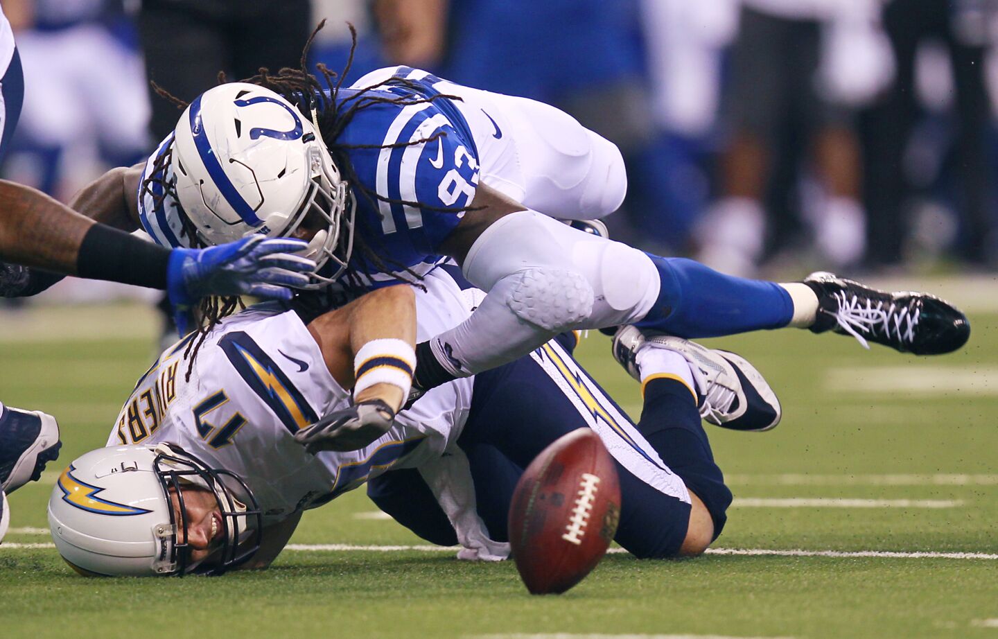 San Diego Chargers Philip Rivers fumbles as Colts Erik Walden hits him in the 2nd quarter at Lucas Oil Stadium on Sunday, Sept. 25, 2016.