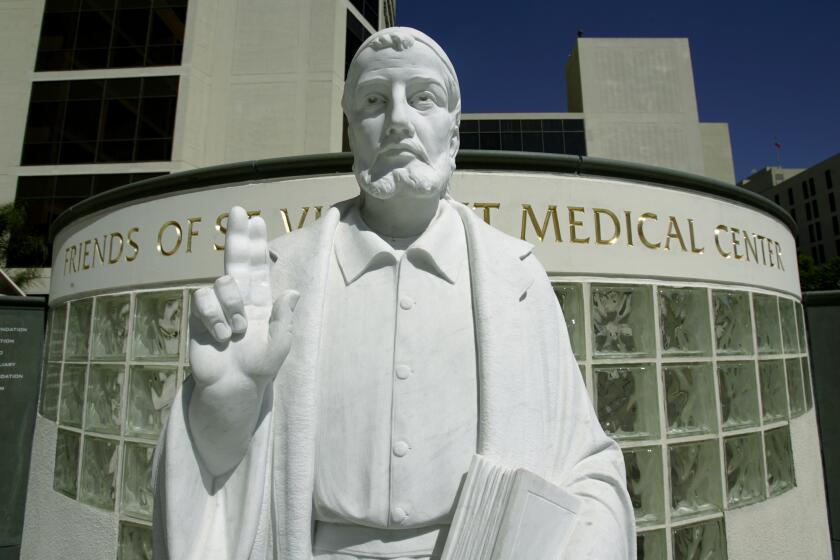 Ferazzi, Gina   102744.ME.0927.organ4.GMFThe statue of St. Vincent making a peace sign stands at the front of St. Vincent Medical Center in Los Angeles. It was announced today during a press conference the Liver Transplantation Program has been placed on temporary inactive status and that surgeons Dr. Richard Lopez and Dr. Hector Ramos are no longer directors of the program. St. Vincent Medical Center has suspended its liver transplant program after auditors discovered that a cashpaying Saudi national was moved to the head of the line for a transplant, bypassing a moreseriously ill local patient. (Gina Ferazzi/Los Angeles Times)