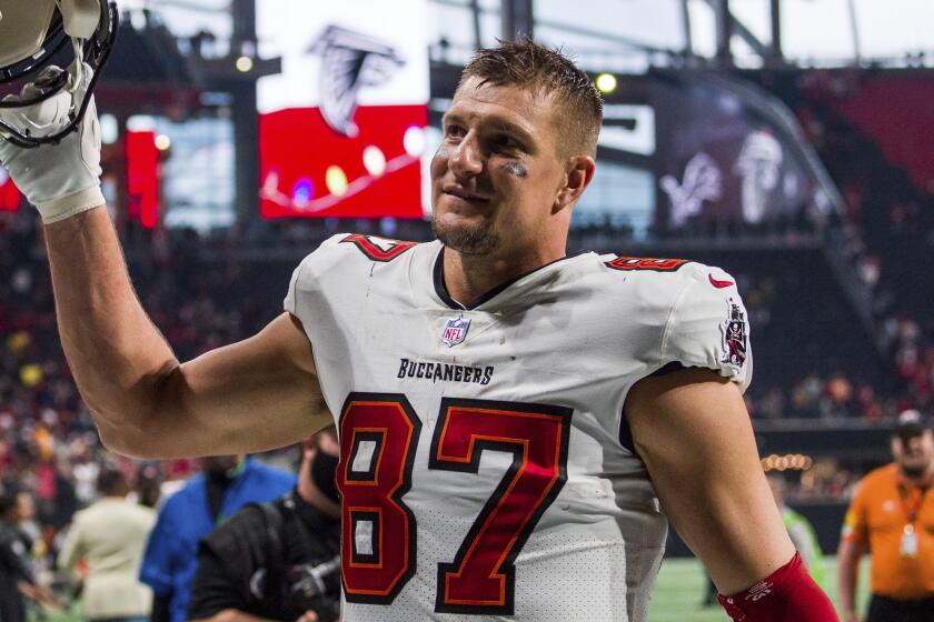 FILE - Tampa Bay Buccaneers tight end Rob Gronkowski (87) waves to fans after an NFL football game.