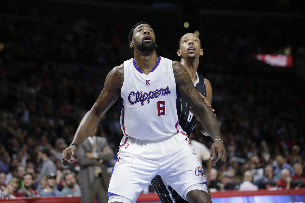 DeAndre Jordan boxes out Orlando forward Channing Frye during the Clippers' 114-86 win over the Magic on Dec. 3 at Staples Center.