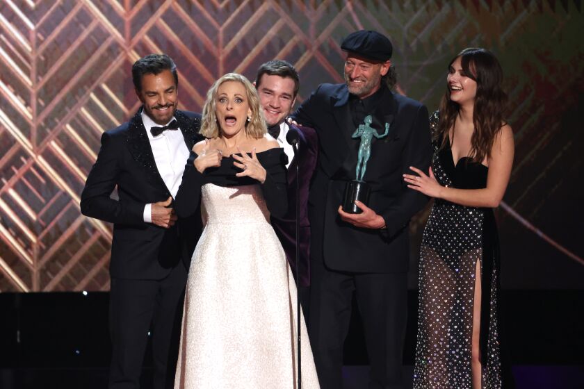 SANTA MONICA, CA - February 27, 2022 (L-R) Eugenio Derbez, Marlee Matlin, Daniel Durant, Troy Kotsur and Emilia Jones accept the award for Outstanding Performance by a Cast in a Motion Picture for CODAduring the show at the 28th Screen Actors Guild Awards at the Barker Hangar on Sunday, February 27, 2022. (Robert Gauthier / Los Angeles Times)