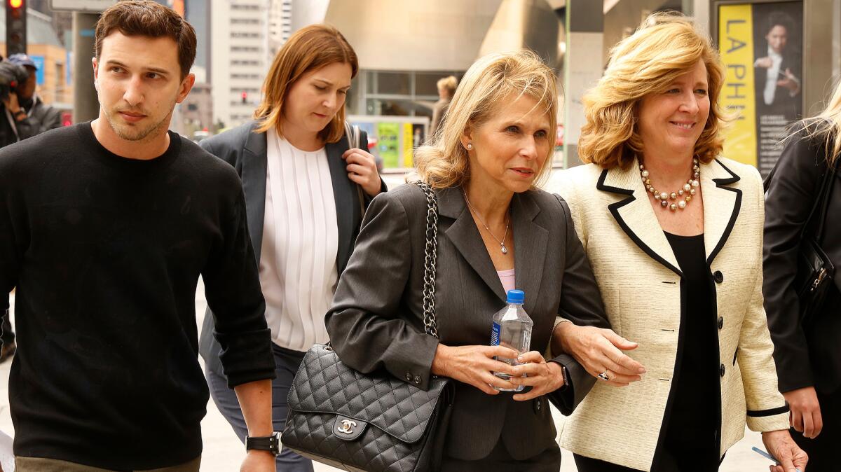 Shari Redstone, center, with her son Brandon Korff, left, and attorney Elizabeth Burnett, right, depart the Stanley Moss Courthouse in Los Angeles on May 6, 2016.
