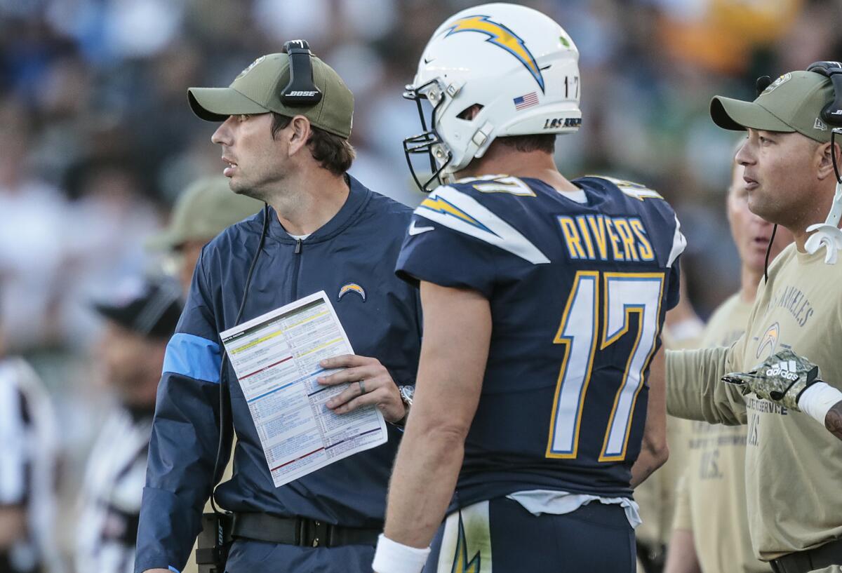 Chargers play-caller Shane Steichen stands next to quarterback Philip Rivers on the sideline during a 26-11 win over the Green Bay Packers on Sunday.