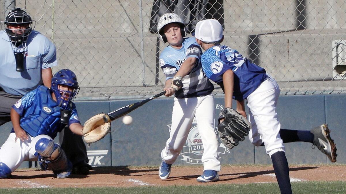 Matthew Melton drives in a run for Newport Beach in the first inning against Walnut Valley in a PONY Bronco 11-and-under West Zone tournament game at Creekside Park in Walnut on Friday.