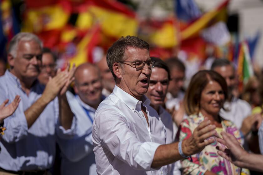 Alberto Feijoo, leader of the mainstream conservative Popular Party, waves during a rally in Madrid, Spain, Sunday, Sept. 24, 2023. The leader of Spain's conservatives will have his opportunity to form a new government this week in what has been preordained as a lost cause given his lack of support in the Parliament. Alberto Nunez Feijoo's Popular Party won the most seats from inconclusive elections in July but fell well short of a majority. (AP Photo/Manu Fernandez)