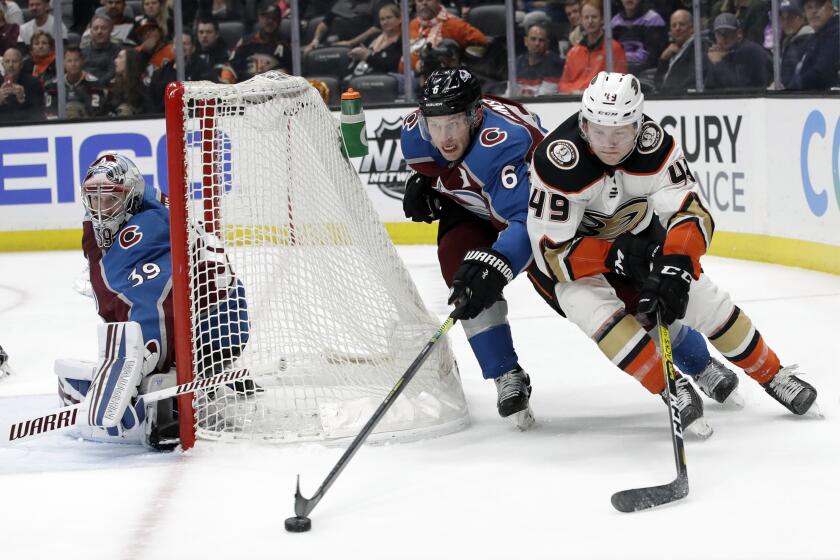 Avalanche defenseman Erik Johnson chases Ducks left wing Max Jones during the second period of a game Feb. 21 at Honda Center. 