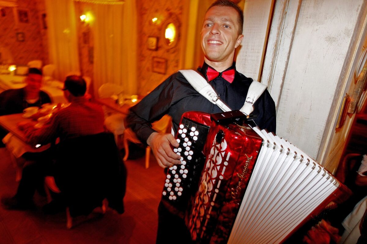 John Harmon plays the button accordion at Mari Vanna, a Russian-style restaurant on Melrose Place in Los Angeles.