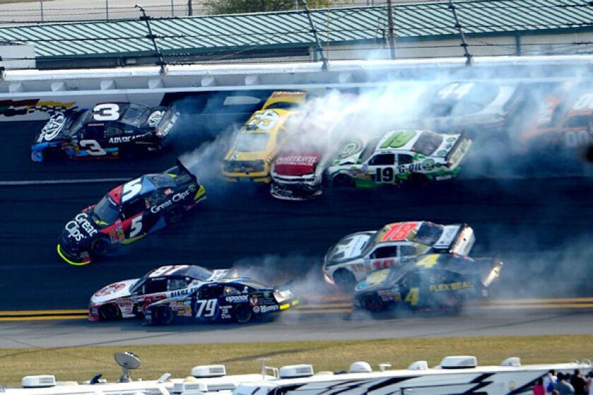 Michael Annett, in the yellow car, was injured in a multiple-car crash late in the race.