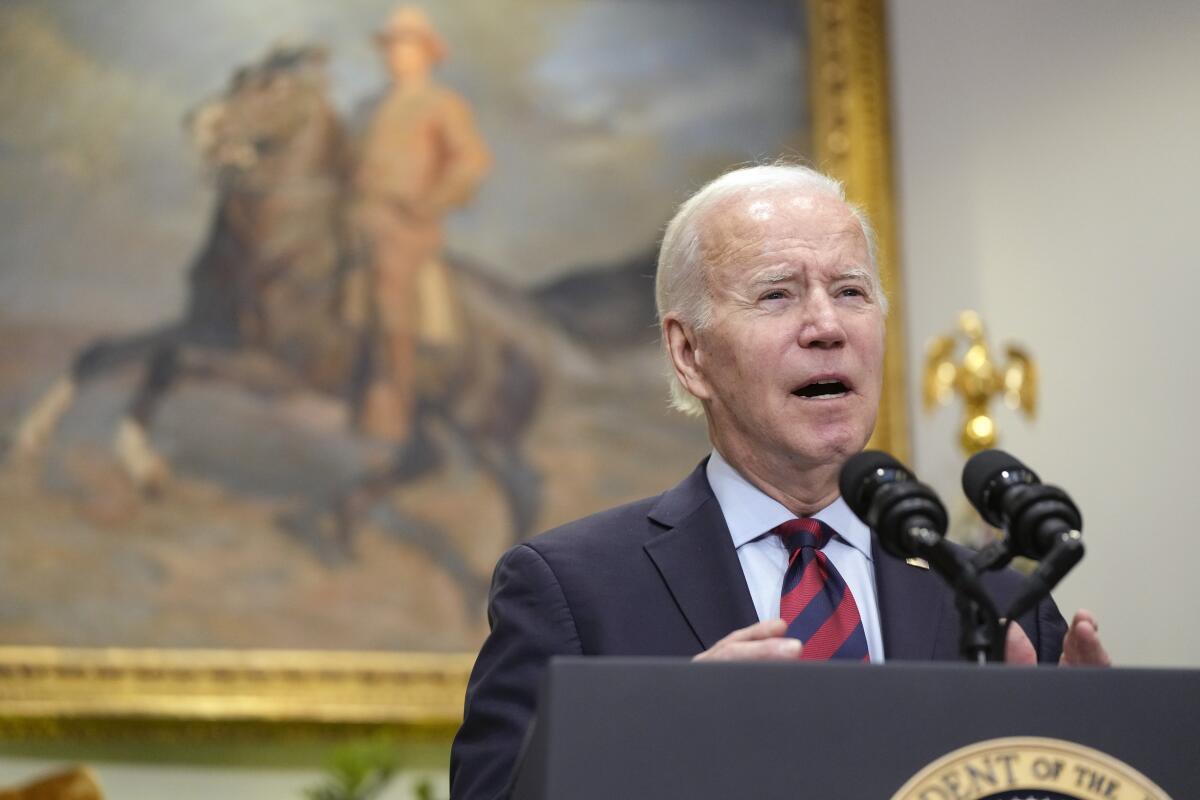 President Biden speaks at a lectern in front of a painting of a man on a horse.