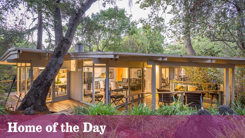 Built atop a leafy hillside, and spanning a natural stream below, this San Rafael home by architect J.W. Putnam is listed for $1.449 million.