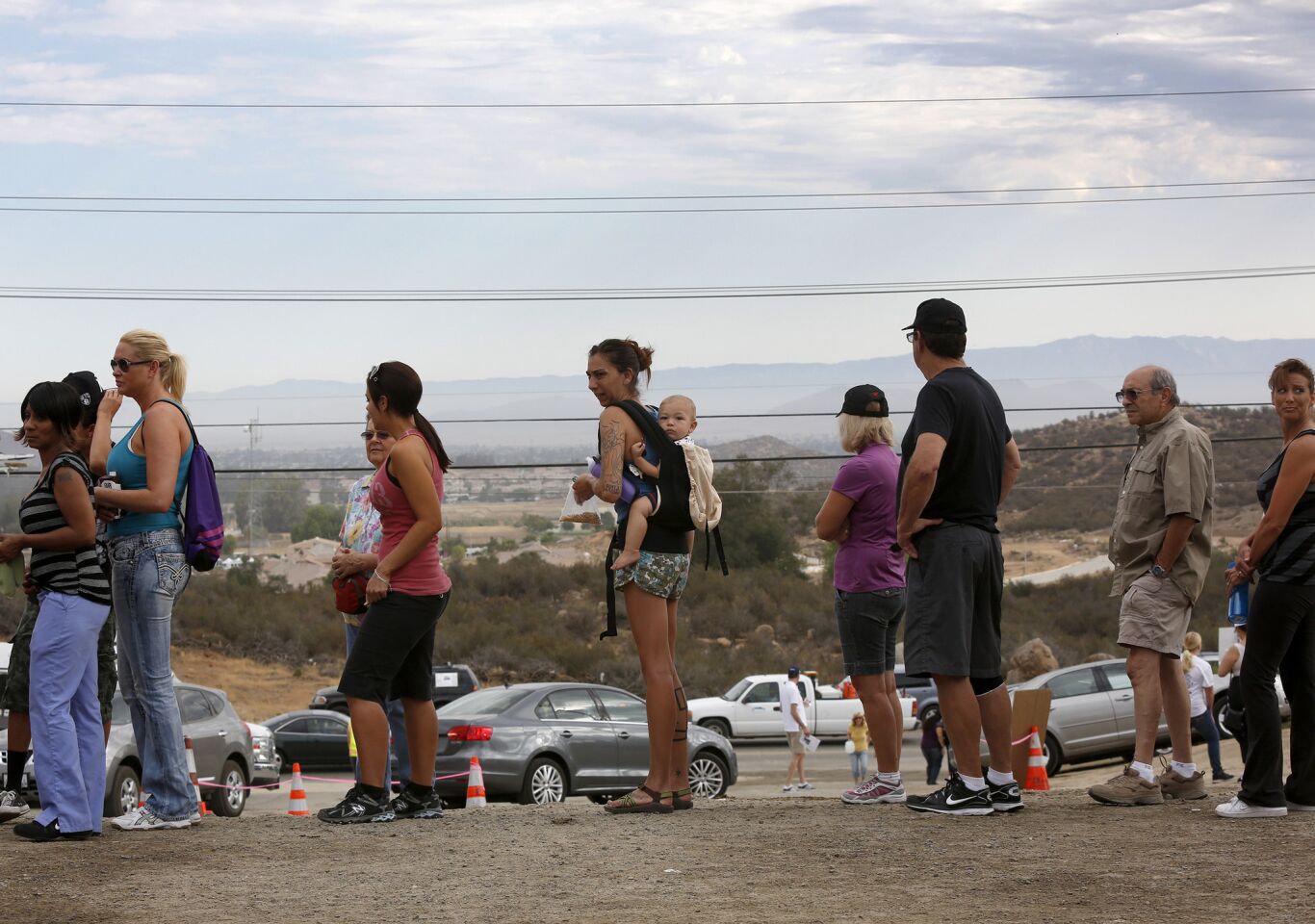 Volunteers wait in line to sign up for the search Tuesday morning.