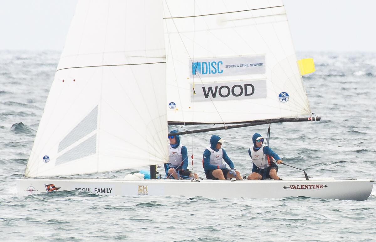 Balboa Yacht Club skipper David Wood, right, and crew members Max Mayol, middle, and Daniel Pegg compete on the second day of racing in the 53rd Governor's Cup in Newport Beach on Wednesday.