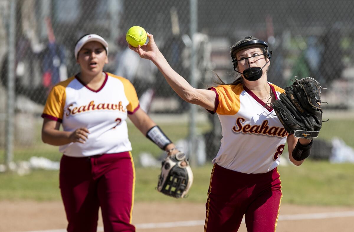 Ocean View pitcher Kaitlyn Knobbe throws out Irvine's Evelyn Shen at first in a CIF Division 5 quarterfinal.