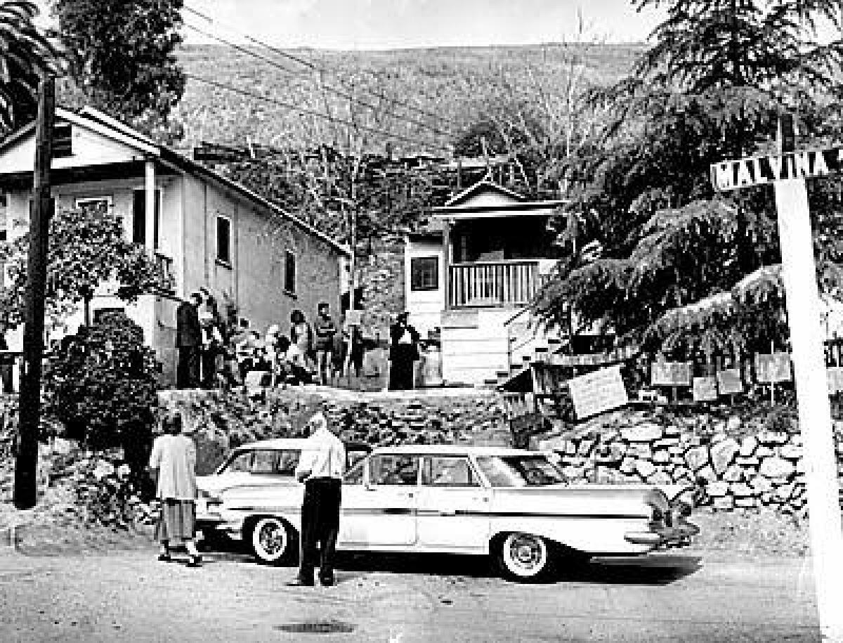 Residents of Chavez Ravine, on the site of what is now Dodger Stadium, await the next move in an eviction battle in 1959. 