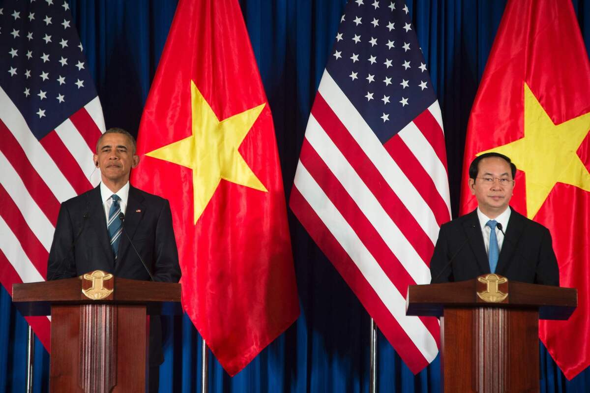 President Obama and Vietnamese President Tran Dai Quang speak during a joint news conference in Hanoi.