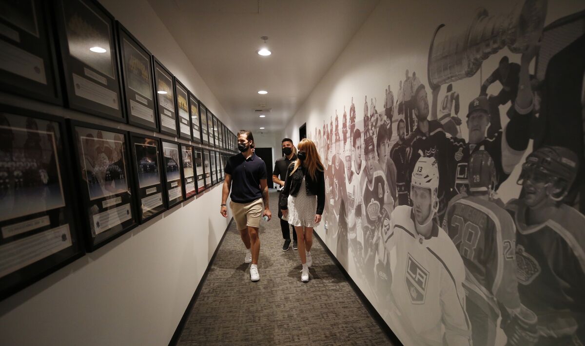 Phillip Danault and wife Marie are taken on a tour of the Kings' practice facility Tuesday.