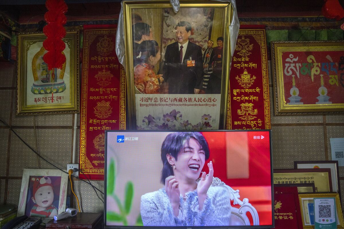 TV below portrait of China's president