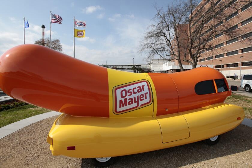 FILE - The Oscar Mayer Wienermobile sits outside the the Oscar Meyer headquarters, Oct. 27, 2014, in Madison, Wis. On Wednesday, Sept. 20, 2023, four months after announcing that the hot dog-shaped Wienermobile was changing its name to the Frankmobile, Oscar Meyer said that the one-of-a-kind wiener on wheels is reverting to the original. (M.P. King/Wisconsin State Journal via AP, File)