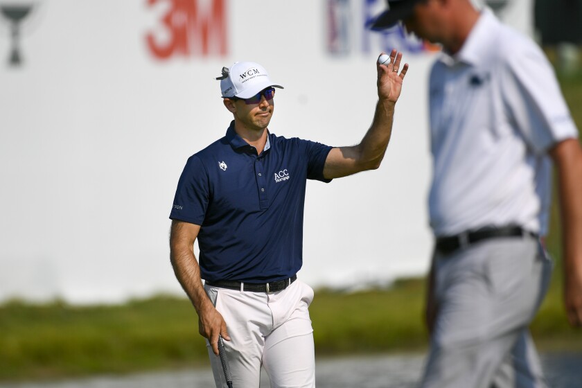 Cameron Tringale acknowledges the crowd after he finished the third round in the lead at the 3M Open.