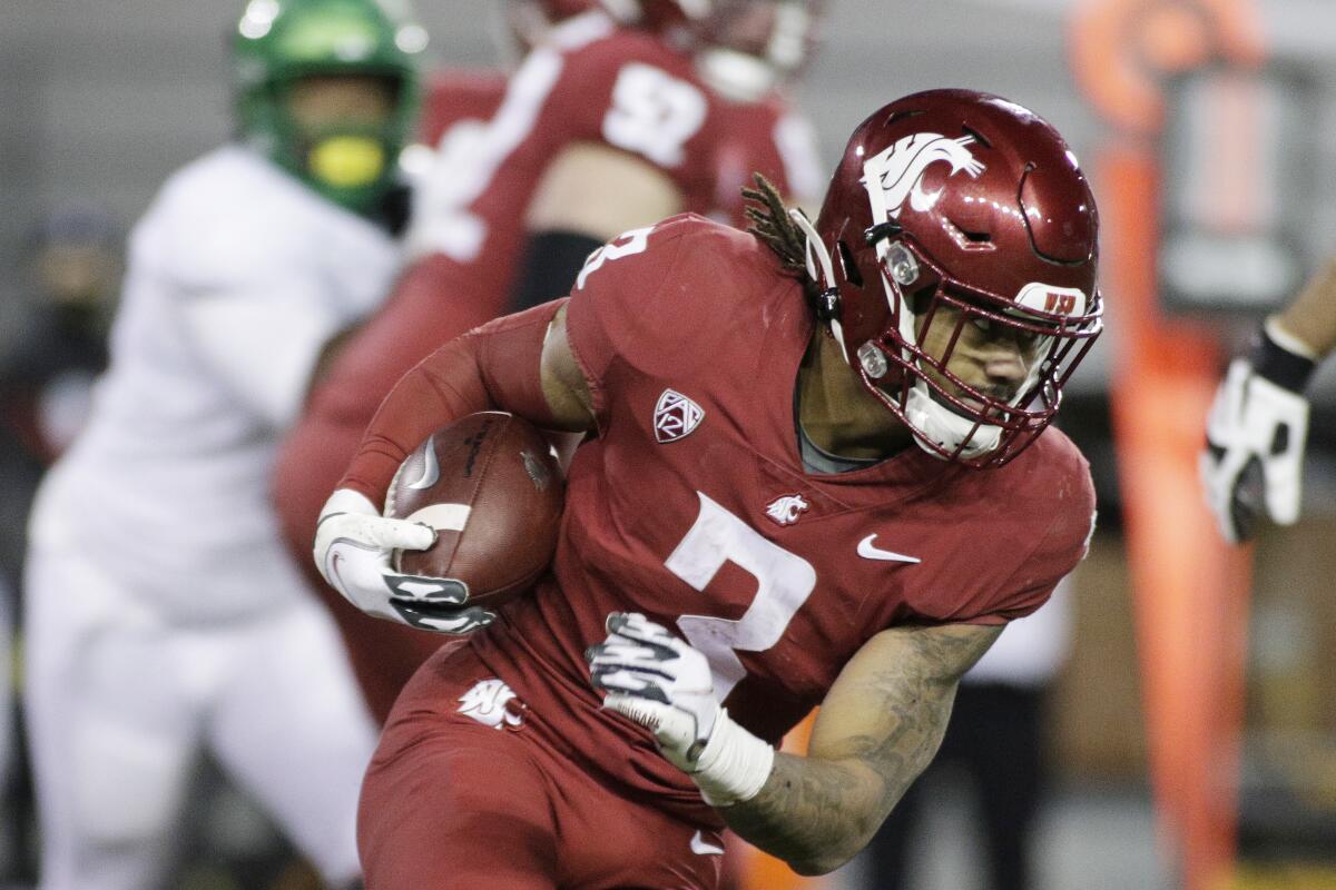 Washington State running back Deon McIntosh carries the ball against Oregon.