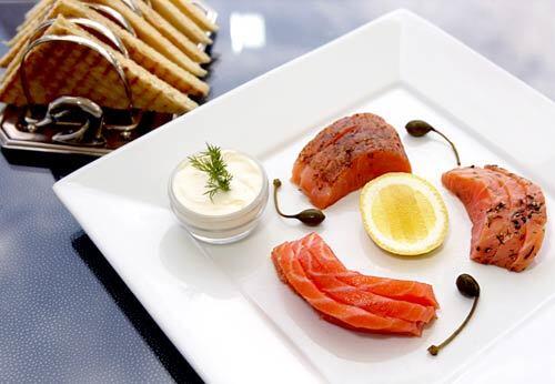 The Tzar Cut Trio showcases Petrossian Cafe's indulgent offerings. The dish includes thick sashimi-sized slices of each of three types of salmon: the buttery fillet from the center of the fish, another marinated in spices and smoked extra slowly, and one marinated in dill.
