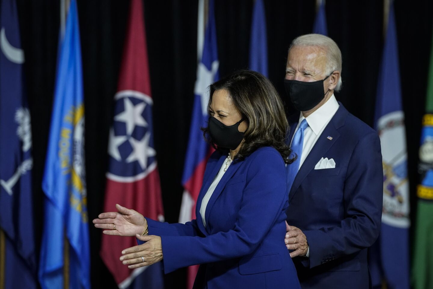 The candidates arrived wearing masks.