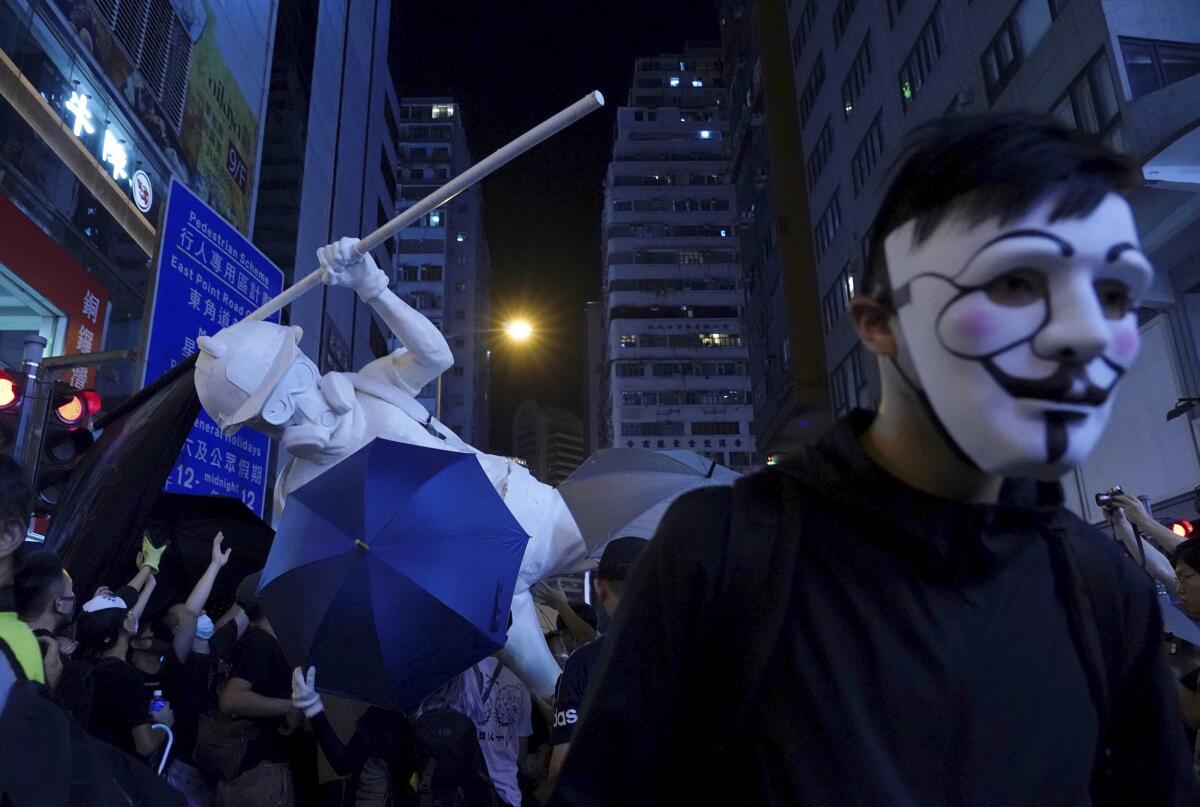 A masked protester at a demonstration in Hong Kong.