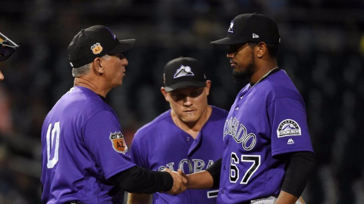 Rockies Manager Bud Black (10) takes pitcher German Marquez (67) out of a spring training game on Mar. 10 in Goodyear, Arizona.