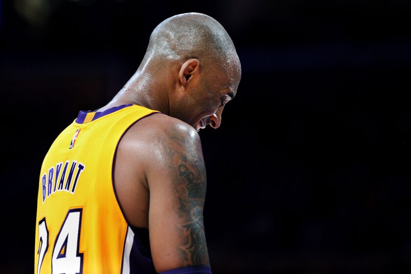 Lakers Kobe Bryant smiles during the final game of his career