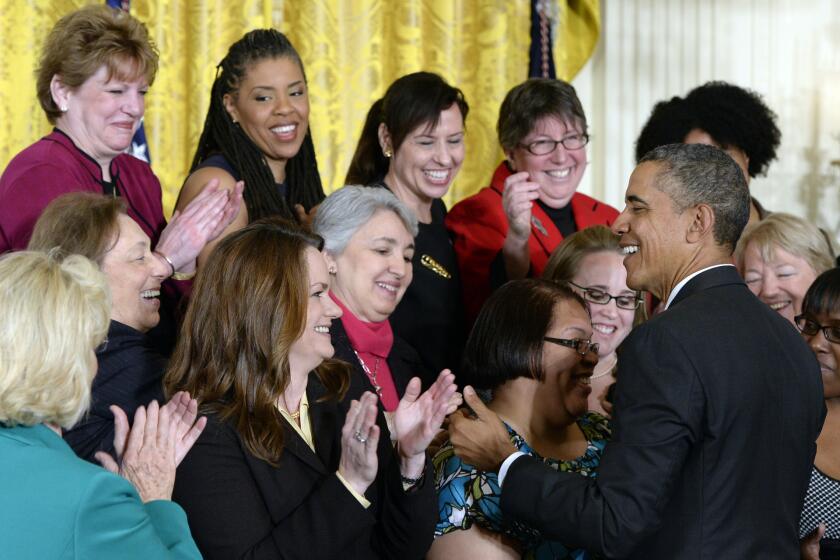 President Obama greets people in the East Room of the White House during an event marking Equal Pay Day on April 8, 2014.