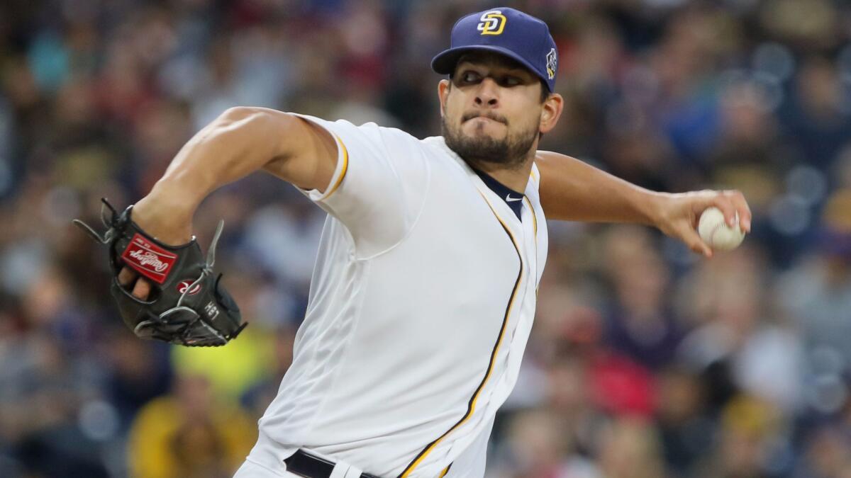 San Diego Padres relief pitcher Brad Hand reacts to walking