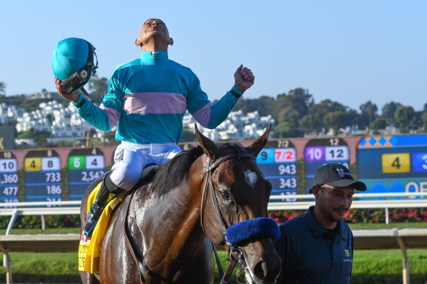 Jockey Mike Smith celebrates aboard Pinehurst after winning the Runhappy Del Mar Futurity on Sept. 6, 2021.