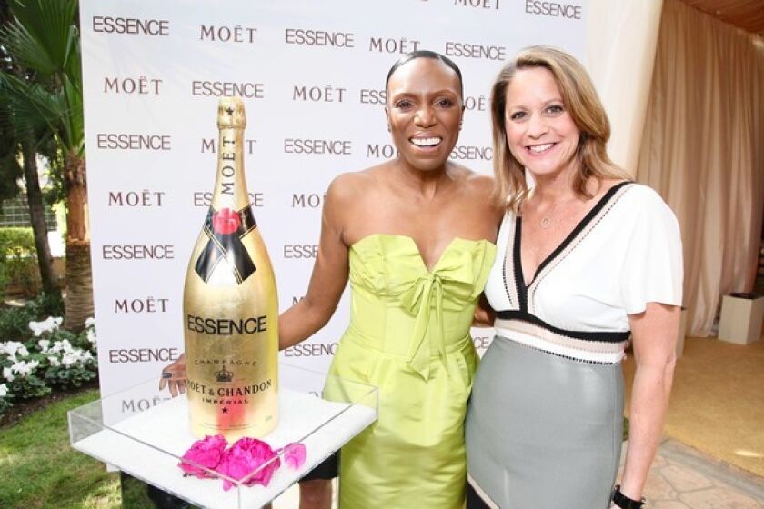 Mikki Taylor and Anne DiGiovanna arrive at the Essence Black Women in Hollywood luncheon.