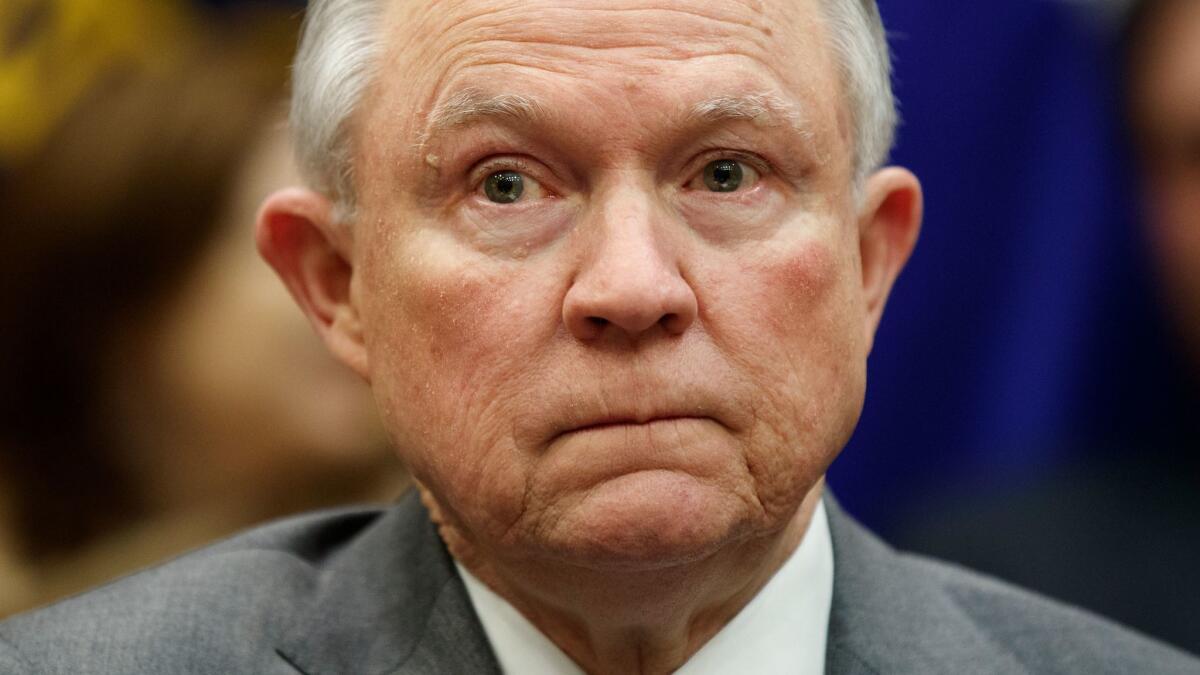 Attorney General Jeff Sessions listens during a meeting with President Trump in the White House on Feb. 22.