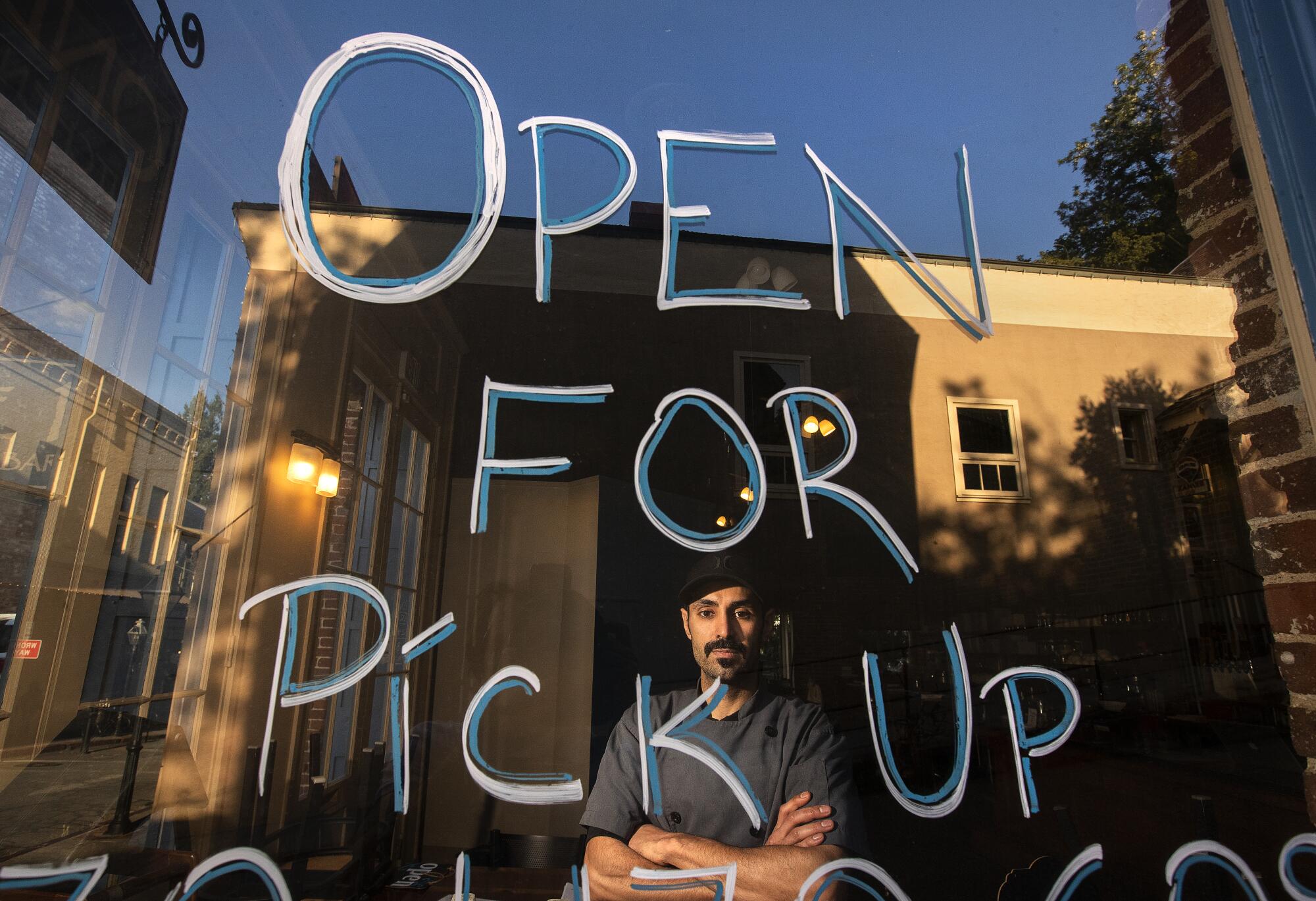 Lior Rahmanian inside his business that is still doing curbside pick up.