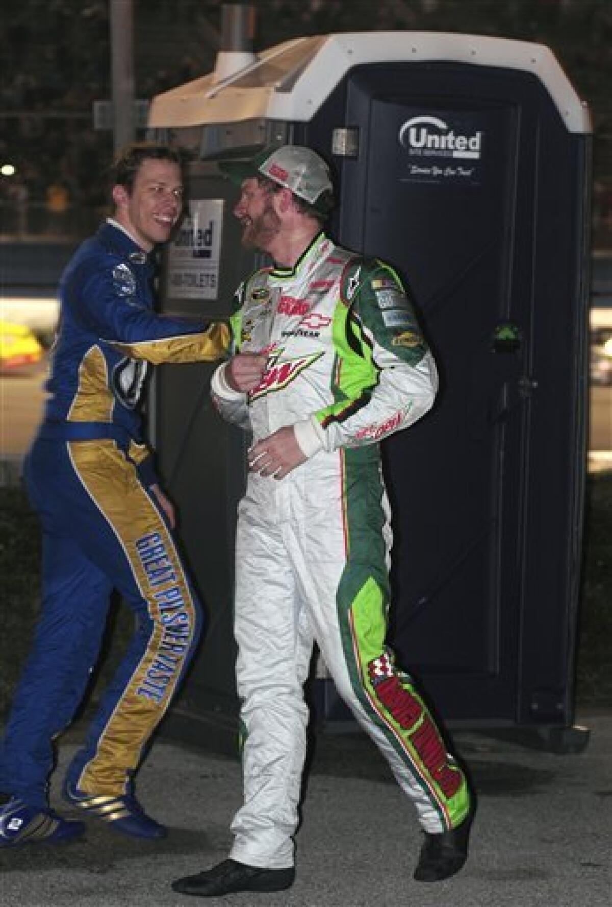 Dale Earnhardt Jr., right, jokes with Brad Keselowski, left, during a red flag in the NASCAR Daytona 500 auto race at Daytona International Speedway in Daytona Beach, Fla., Monday, Feb. 27, 2012. (AP Photo/Barkley Wyckoff)