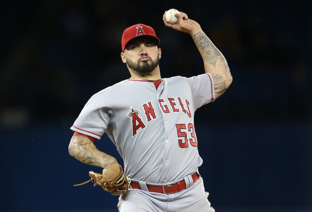 Angels left-hander Hector Santiago escapes several tight situations against the Blue Jays.