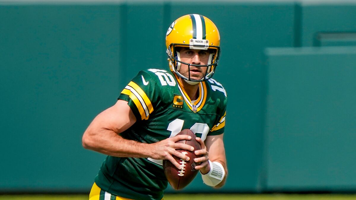 Green Bay Packers quarterback Aaron Rodgers scrambles.