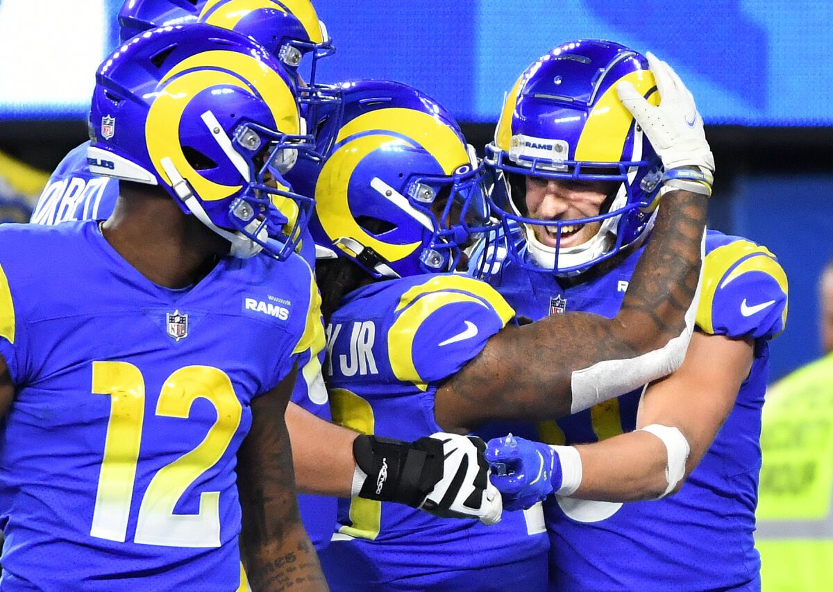 Rams receiver Cooper Kupp, right, celebrates with teammates after scoring a touchdown.
