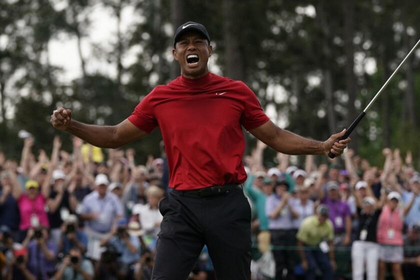 Tiger Woods reacts as he wins the Masters golf tournament Sunday, April 14, 2019, in Augusta, Ga. (AP Photo/David J. Phillip)