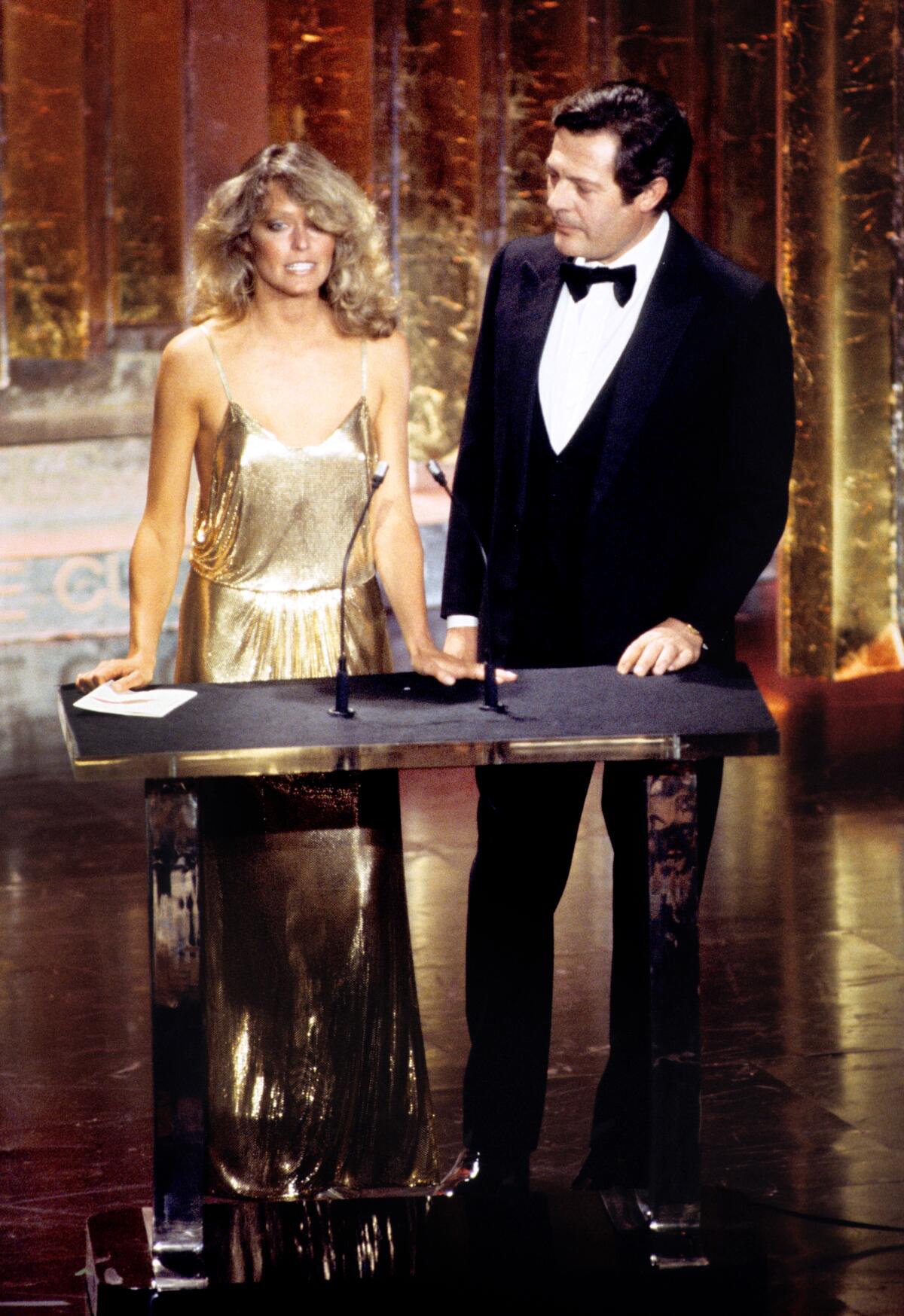 Farrah Fawcett presents an Oscar with Marcello Mastroianni in 1978.
