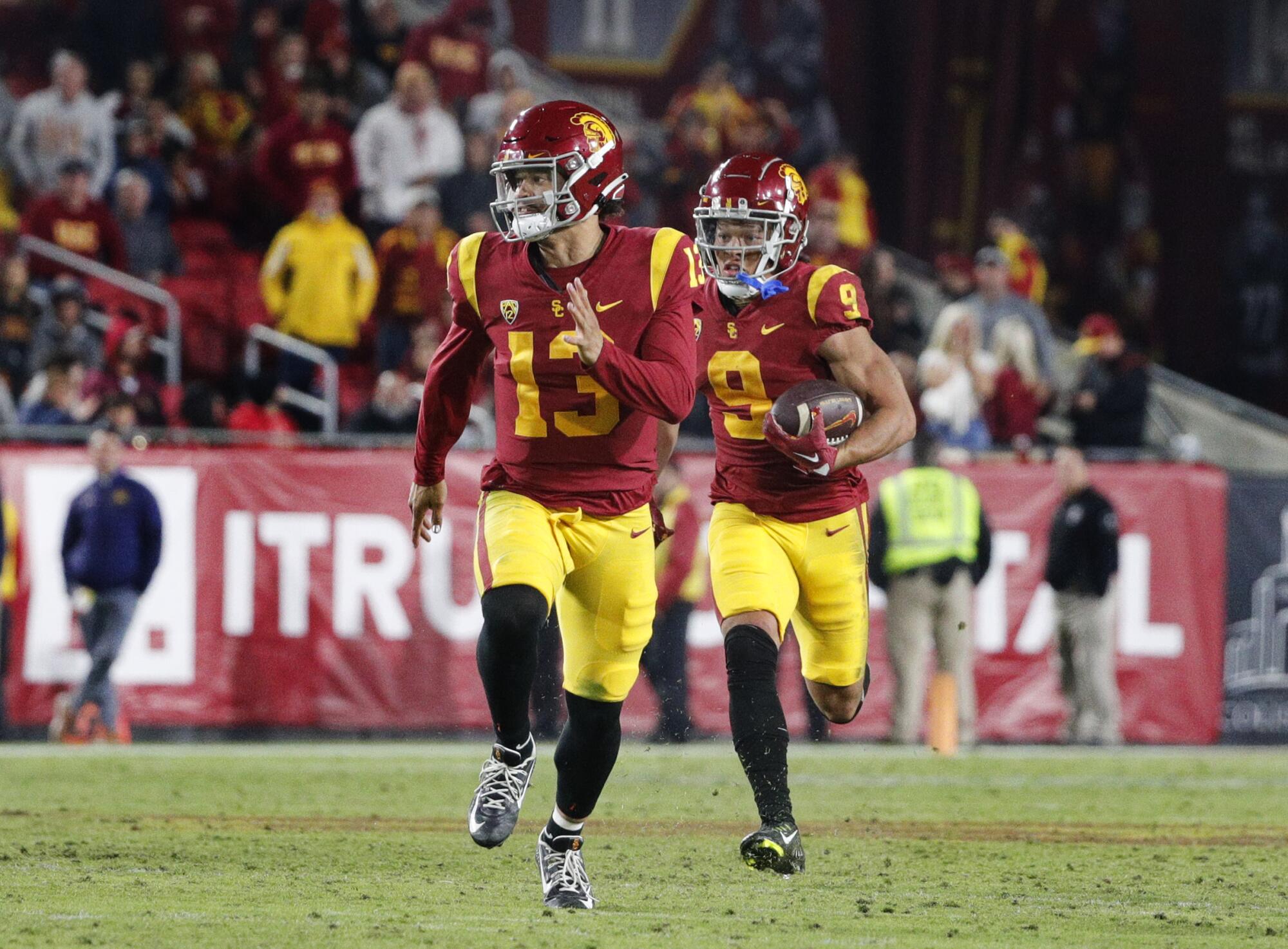 USC wide receiver Michael Jackson III runs behind quarterback Caleb Williams on a reverse.