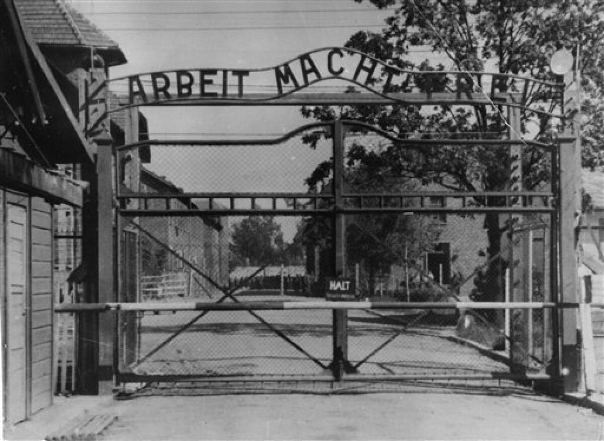 FILE - An undated image shows the main gate of the Nazi concentration camp Auschwitz I, Poland, which was liberated by the Russians, January 1945. Writing over the gate reads: "Arbeit macht frei" (Work Sets You Free). Polish police say the infamous iron sign over the gate to the Auschwitz memorial site with the cynical phrase "Arbeit Macht Frei" _ German for "Work Sets You Free" _ has been stolen. Police spokeswoman Katarzyna Padlo said police believe it was stolen between 3:30 a.m. and 5 a.m. Friday, Dec. 18, 2009, when museum guards noticed that it was missing and alerted police. (AP Photo/File)