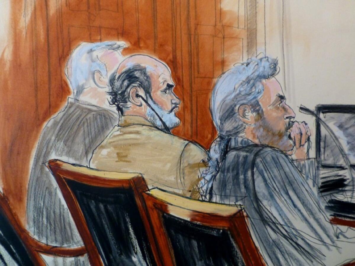Sulaiman abu Ghaith, center, and his attorney, Stanley Cohen, listen to testimony in federal court in Manhattan during Abu Ghaith's trial on terrorism charges.