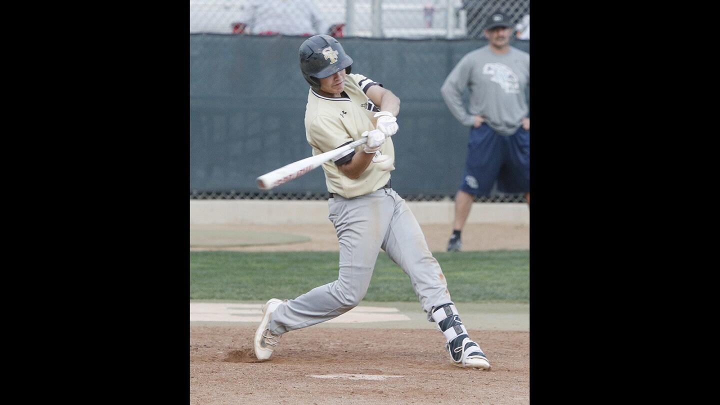 St. Francis' Tyler Quintero hits a two-RBI double against Crescenta Valley in a baseball scrimmage at Stengel Field in Glendale on Friday, February 9, 2018.
