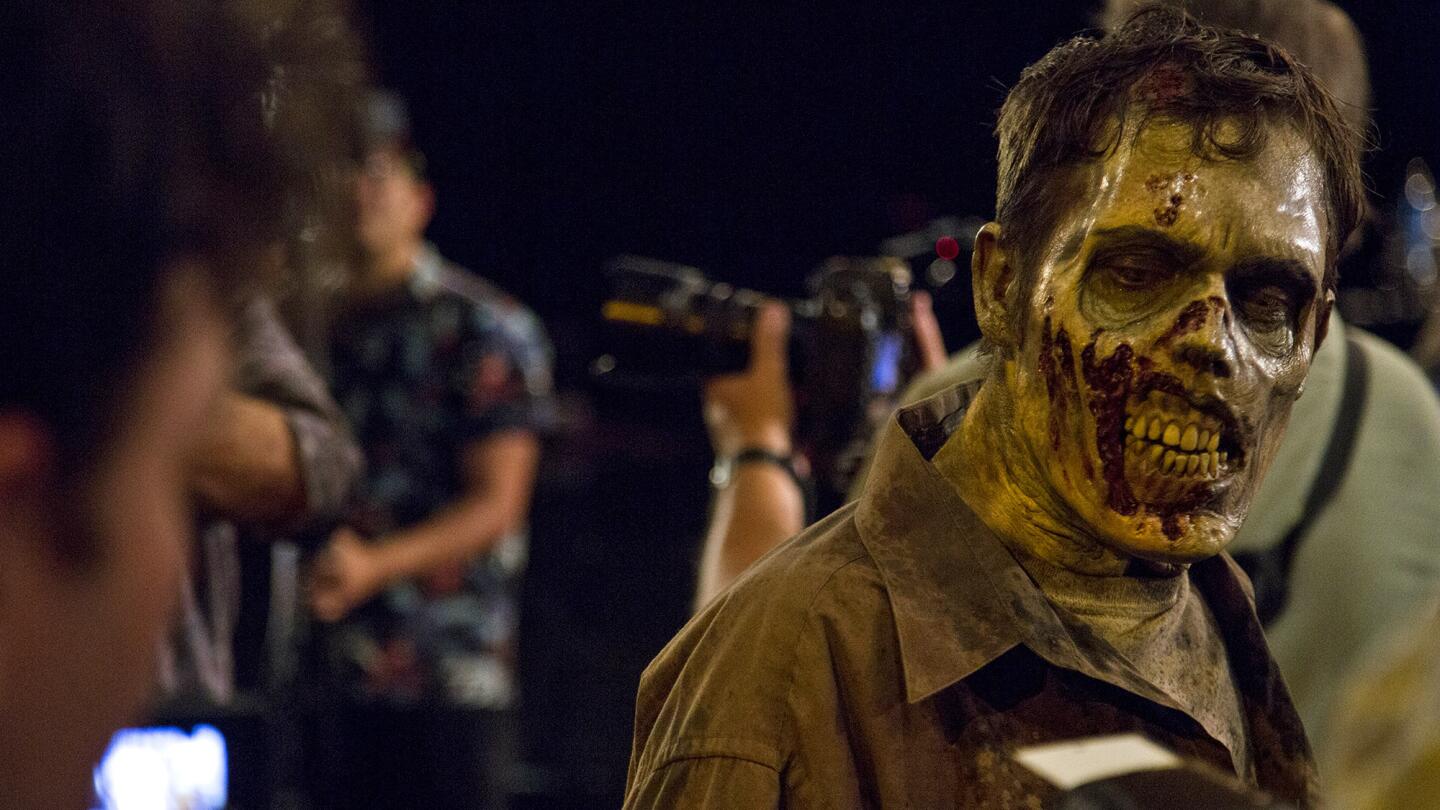 A zombie for a new Universal Studios Hollywood attraction learns some tricks of the trade at a zombie boot camp taught by Greg Nicotero, executive producer and frequent director of the AMC television series “The Walking Dead.”