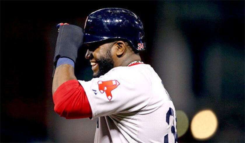 David Ortiz reacts after hitting a single in the eighth inning of the Boston Red Sox's 3-1 victory over the St. Louis Cardinals in Game 5 of the World Series.